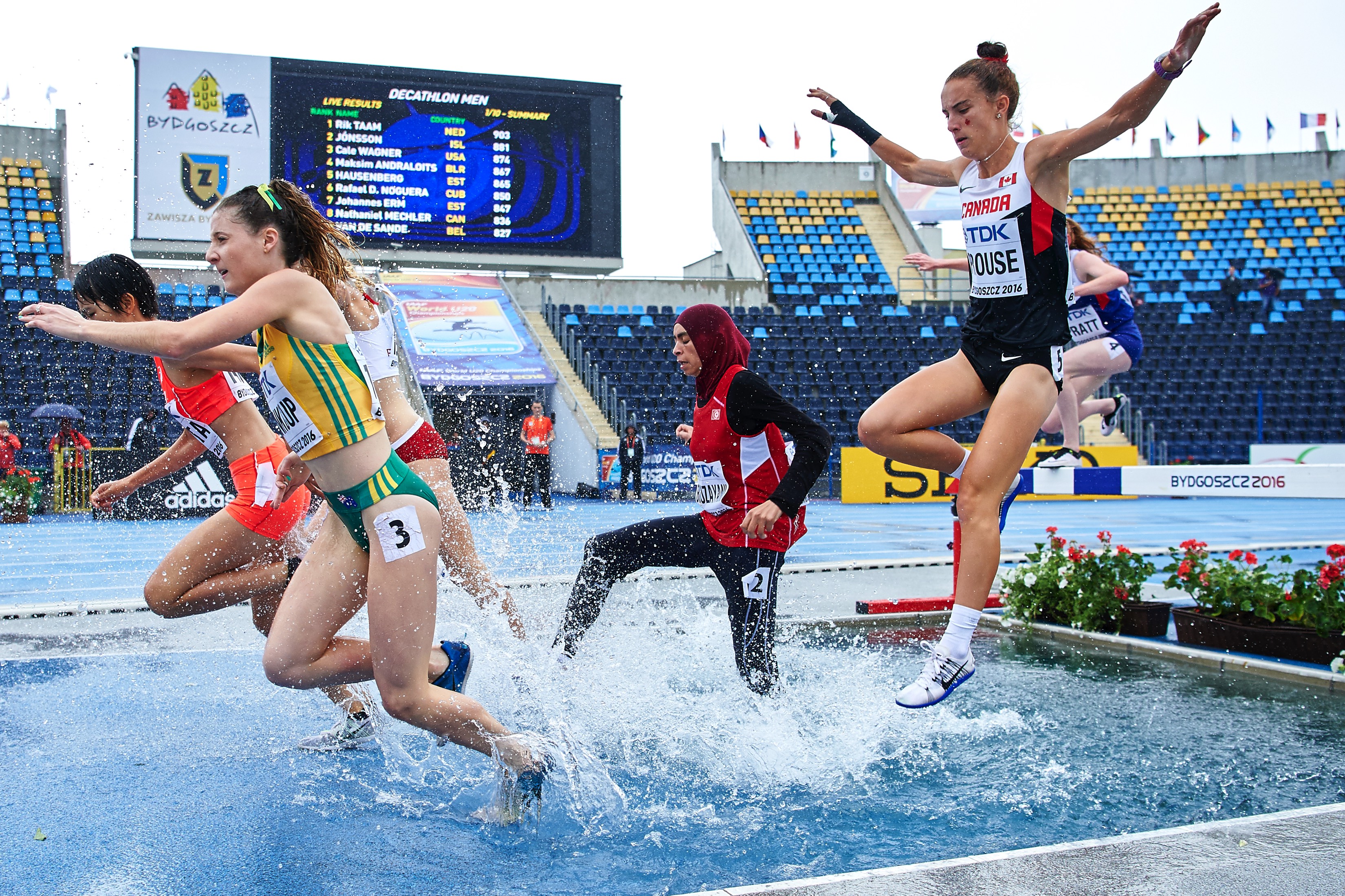 BYDGOSZCZ, POLAND - JULY 19: Georgia Winkcup from Australia (L) and Marwa Bouzayani from Tunisia (C) and Charlotte Prouse from Canada (R) compete in women's 3000 meters qualification during the IAAF World U20 Championships - Day 1 at Zawisza Stadium on July 19, 2016 in Bydgoszcz, Poland. (Photo by Adam Nurkiewicz/Getty Images for IAAF)