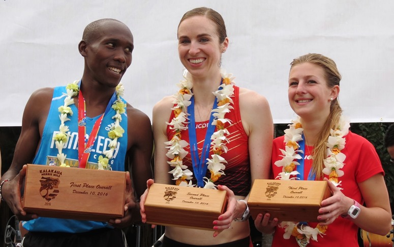 PHOTO: Edwin Kiptoo, Nicole Sifuentes (center) and Shannon Osika after receiving their top-3 awards at the inaugural Kalakaua Merrie Mile in Honolulu on 10 December, 2016 (Photo by Jane Monti for Race Results Weekly)
