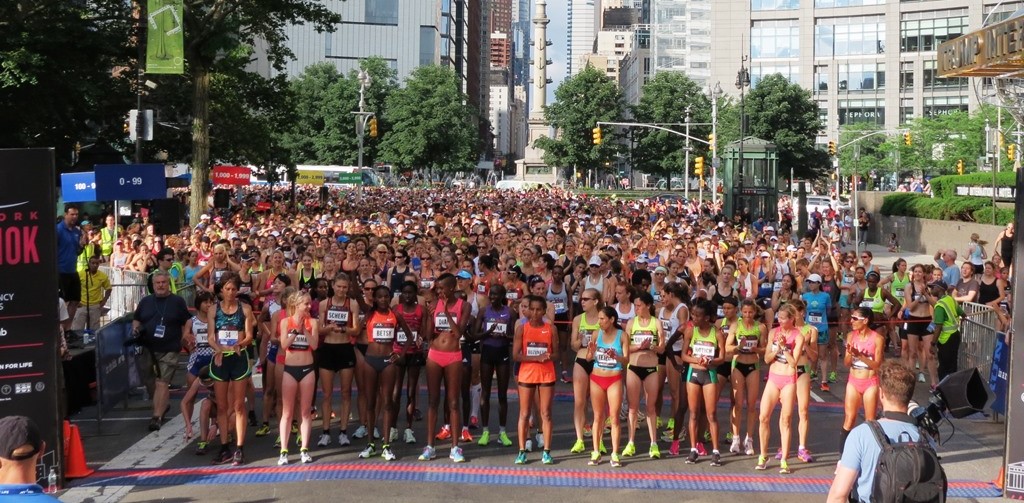  PHOTO: The start of the 2015 NYRR New York Mini 10-K on Central Park West with Columbus Circle in the background (photo by David Monti for Race Results Weekly)