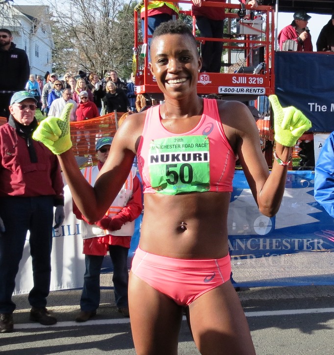  PHOTO: Diane Nukuri celebrating her second consecutive win at the 2015 Manchester Road Race (photo by Jane Monti for Race Results Weekly)