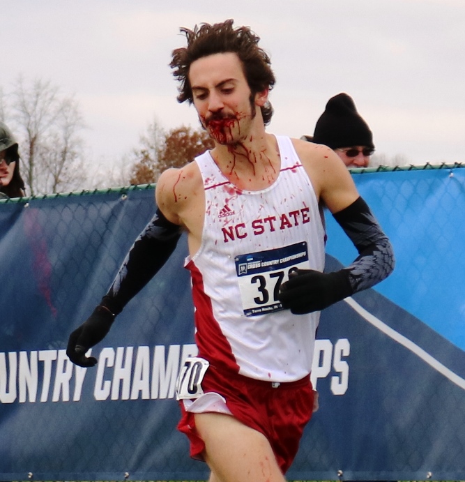 PHOTO: Eli Moskowitz of North Caroline State competing at the 2016 NCAA Division I Cross Country Championships after a bad fall (photo by Chris Lotsbom for Race Results Weekly)